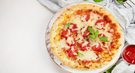 Freshly baked pizza on dark background.