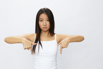 Asian woman hand signals, finger pointing facial skin problems, acne and inflammation, red rash and...