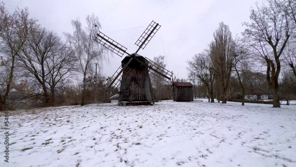 Poster The wooden windmills in winter, Pereiaslav Scansen, Ukraine