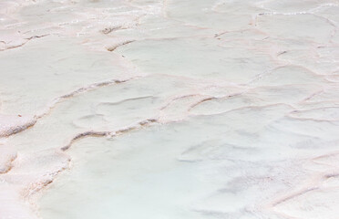 Emerald water in white limestone rock.