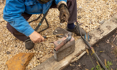 Gas welding of metal at the construction site.