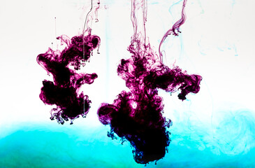 Food colourings dropped into water creating magical patterns and designs as they mix together and...
