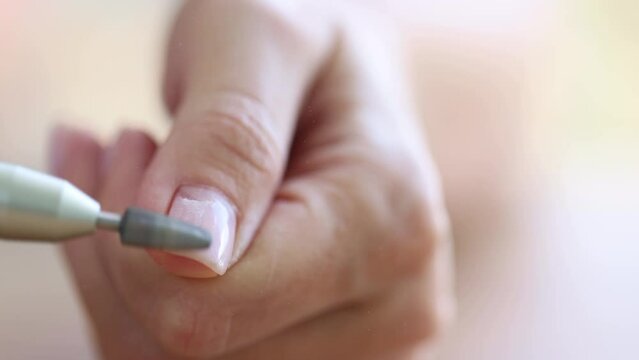 Removing shellac from the nails with fraser. Closeup. Selective focus. 4K