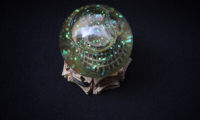 Unique Colosseum rome glass snowball on black isolated background.