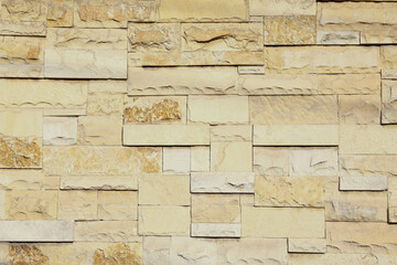 Texture of beige brick wall as background