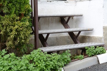 View of empty metal stairs with railing outdoors