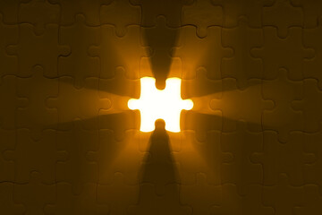 Sun light rays shining through hole from a missing piece of jigsaw puzzle.
