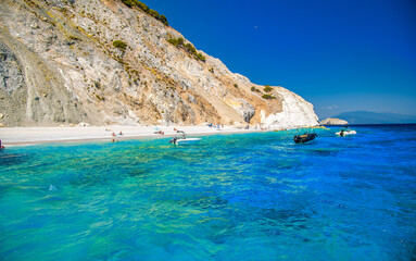 Skiathos, Greece - June 30, 2022: Famous Lalaria beach in Skiathos with tourists