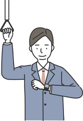 つり革につかまりスマートウォッチをチェックするビジネスマン
