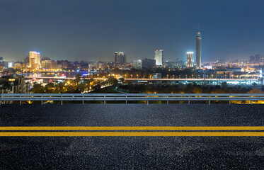 Cairo street at night in Egypt - road in Cairo city with buildings and Cairo tower in Background - 