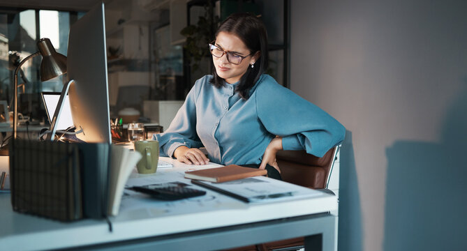 Business Woman, Computer Or Back Pain In Night Office, Digital Marketing Startup Or Advertising Agency Company. Tired, Stress Injury Or Worker On Web Design Technology And Sciatica Crisis Or Burnout