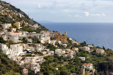 Fototapeta premium Touristic Town, Vettica Maggiore, on Rocky Cliffs and Mountain Landscape by the Tyrrhenian Sea. Amalfi Coast, Italy.