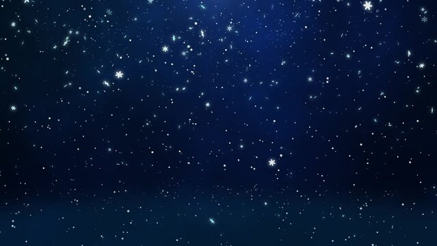 Image of snowflakes dancing in the night sky