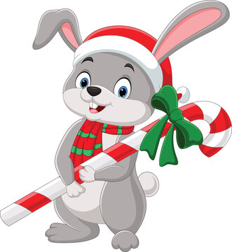 Cartoon rabbit wearing scarf and hat holding candy cane
