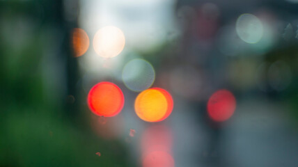 Defocused abstract background of colorful light in the rain