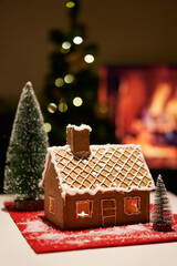 Decorated christmas gingerbread house in homely cozy atmosphere.