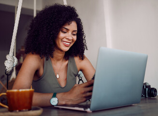 Phone, freelance photographer black woman in cafe and laptop typing on smartphone checking social media. Freelancer at remote work, reading good news email for creative project in coffee shop.