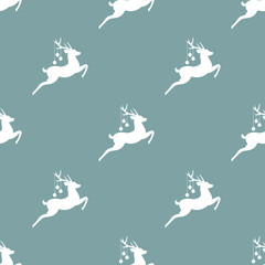 seamless winter pattern with white silhouette of deers with antlers and christmas tree toy balls on horns. vector flat Christmas ornament on powder blue background