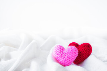 Abstract valentine 's day, Red Heart Knitting on white fabric linen texture for graphic design wedding or add text message. Love concept.