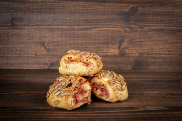 Meat patties with seeds. Wood texture background