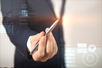 Male hand holding a digital pen Businessman working in modern office. Presentation concept. Close-up shot.