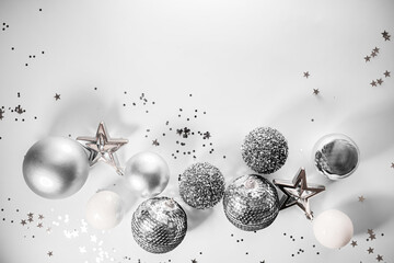 
creative new year layout with silver and white christmas decorations isolated on white background....