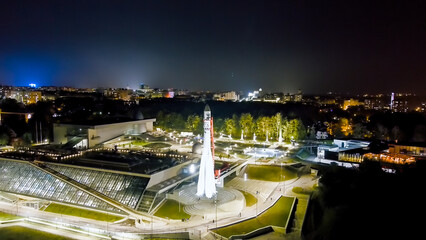 Kaluga, Russia. Yachenskaya embankment. Space rocket. Night flight over the city, Aerial View
