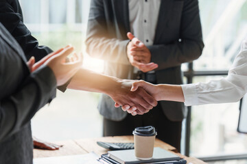 Business partnership meeting concept. Image businessmans handshake. Successful businessmen handshaking after good deal. Group support concept