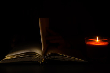 Fototapeta na wymiar a candle and a notebook