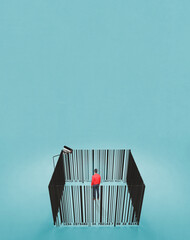 Conceptual image-human dependence on the market-Bar code in the form of a prison-cage and a man...