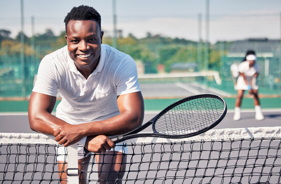 Tennis, Fitness Portrait Or Black Man With Smile For Training, Motivation Or Sport Workout In Tennis Court. Athlete, Happy Or Tennis Player For Wellness, Exercise Or Health Outdoors Leaning On Net