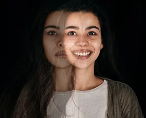 Depression, mental health and woman with stress, anxiety and bipolar on black background with double exposure. Psychology, depressed and dark horror face of a crazy girl with a mind problem in studio © L Ismail/peopleimages.com