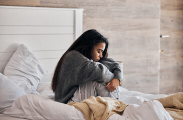 Sad, depression and woman with stress in bedroom thinking of a break up, broken heart or mental health problems. Divorce, stressed or depressed girl with insomnia, anxiety or negative memory at home