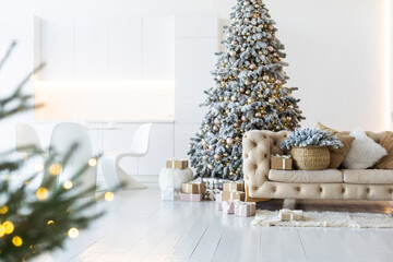Classic white christmas interior with new year tree decorated. grey chair and presents under the...