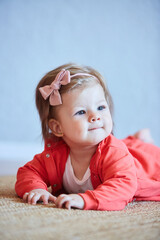 Fototapeta premium A small newborn baby girl. The concept of childhood