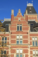 Fototapeta na wymiar Amsterdam Rijksmuseum Building Exterior Detail with Bright Blue Sky, Netherlands