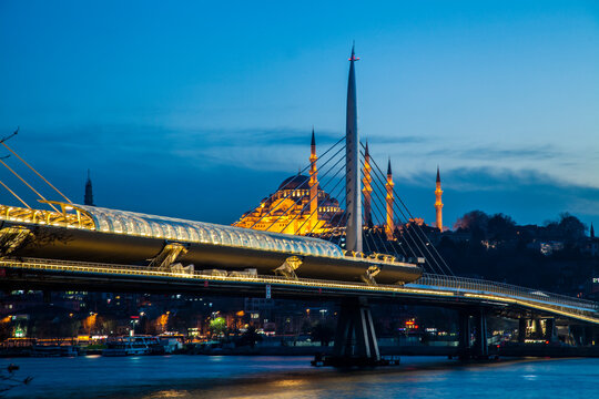 city by night with moque and bridge