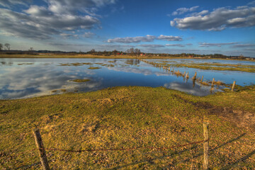 Landscape sunset or sundown river Narew Poland Europe spring time meadows under water