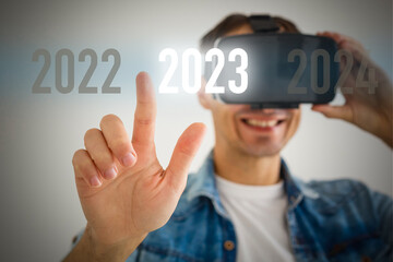 vr headset pc gadget point index finger aside on area. Happy New Year 2023 holiday concept