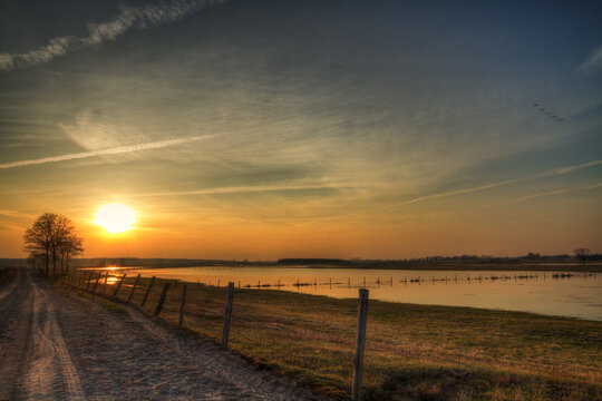Landscape sunset or sundown river Narew Poland Europe spring time meadows under water © Marcin Perkowski