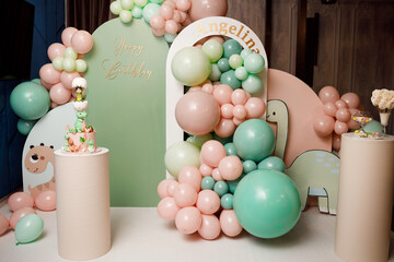Decorations for holiday party. A lot of balloons blue and white colors. Round photo zone with balls