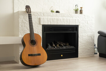 the acoustic guitar is at home