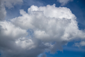 Textured background of white and blue clouds visible during the day