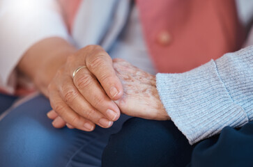 Elderly woman, holding hands and close up of support, care and trust relationship bonding together....