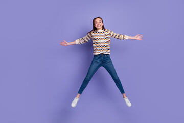 Fototapeta na wymiar Full body photo of lovely girl raising hands arms aside jumping isolated over bright color background
