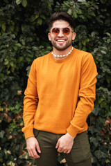 vertical portrait of modern latin man laughing to the camera