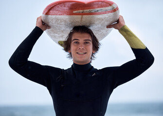 Portrait of happy surfer, man with surfboard and ocean surfing sport outdoors for free fitness,...