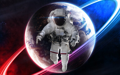 Astronaut on background of deep space planet in light of red and blue star. Science fiction....