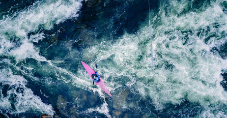 Aerial view extreme kayak boat rough river, sunny day. Concept overcoming obstacles and...