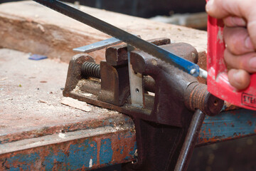 Working on a vise on a workbench